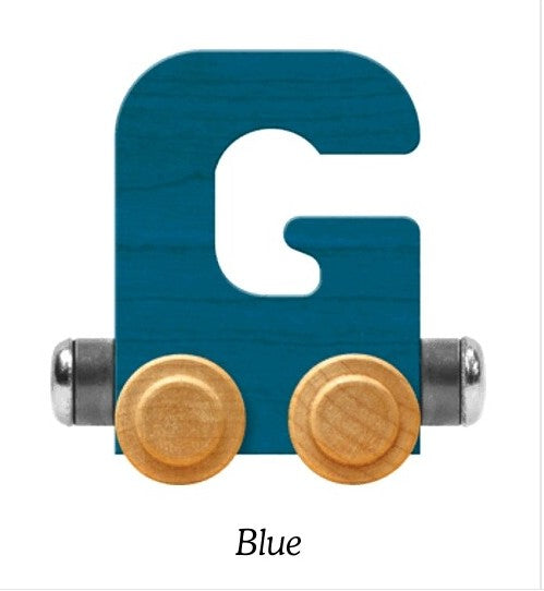 A wooden letter G toy train block in a medium blue color, featuring natural wood wheels and metal connectors, shown on a white background with the word 'Blue' underneath.