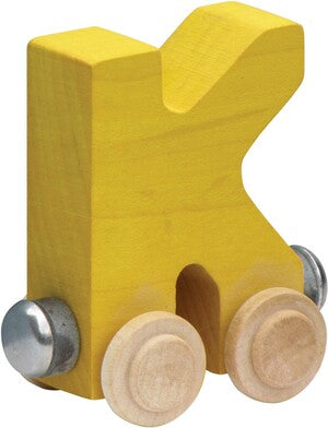 Yellow letter 'K' toy with wheels on a white background