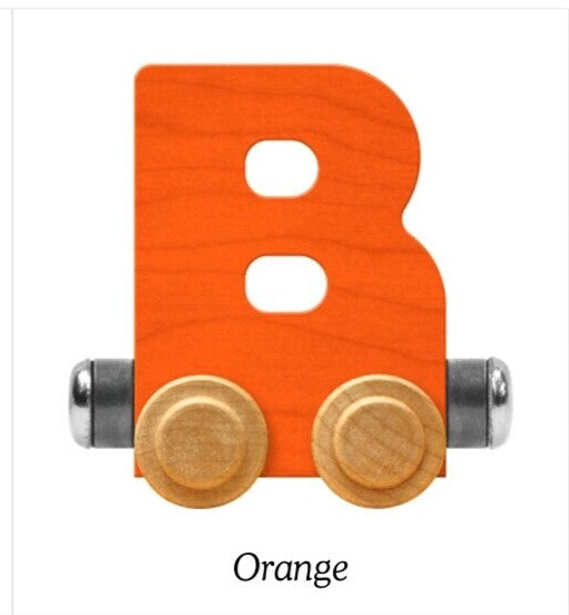 An orange wooden letter B toy train car with two light wood wheels and silver metal axles, shown on a white background with the word 'Orange' below.
