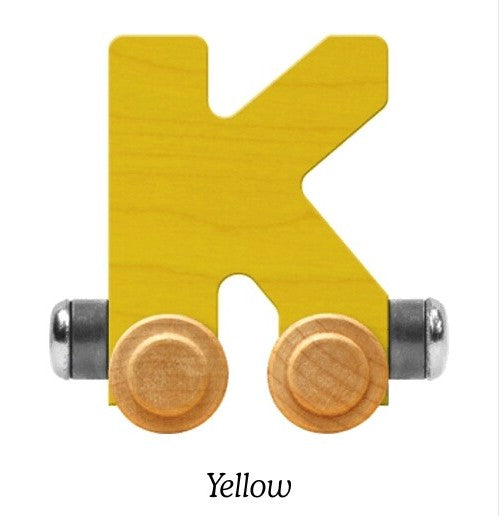 A yellow wooden letter K toy with two small wheels, shown on a white background with the word 'Yellow' underneath.